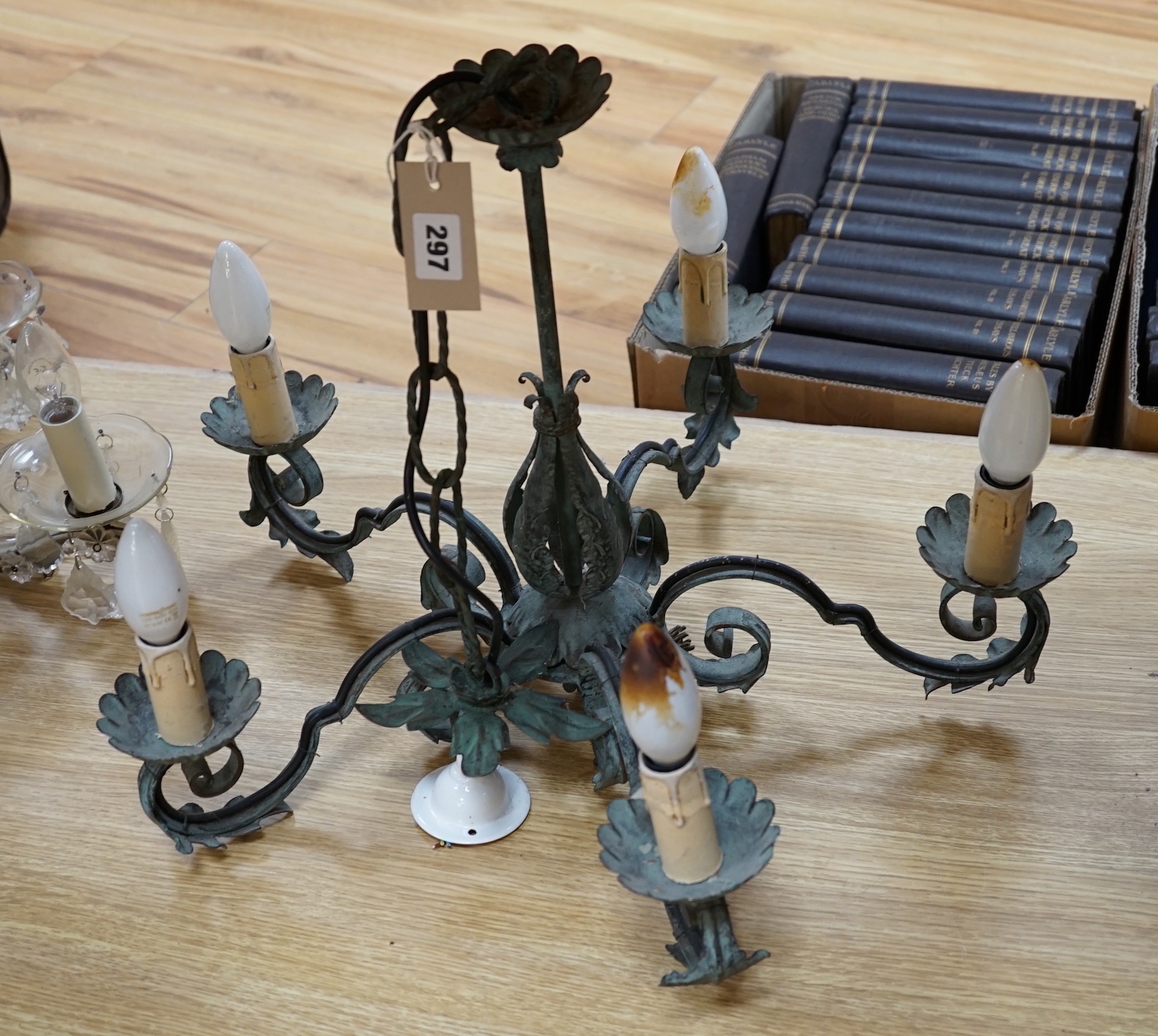 A Venetian cut glass chandelier with lustre drops and a five branch wrought metal example, largest 51cm in diameter